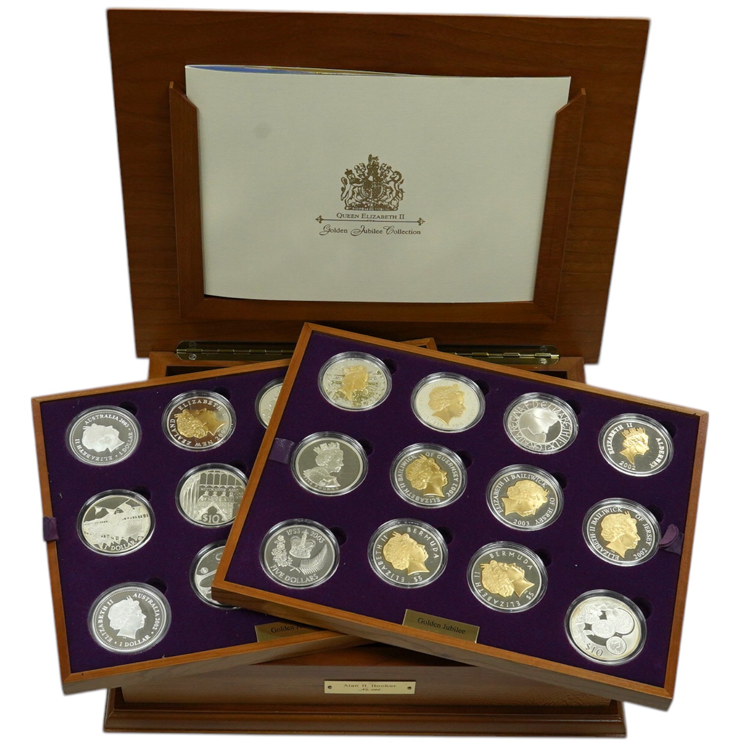 Royal Mint UK QEII Golden Jubilee collection of 24 silver proof coins, 2002, each 28.28g, in wood case fitted with two trays, with individual certificates and album